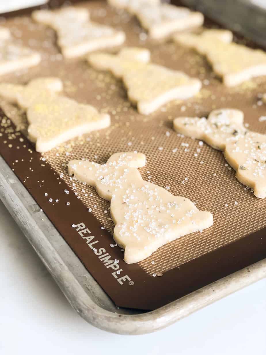 Lemon Lavender Shortbread cookies unbaked on a baking sheet lined with a silicon mat