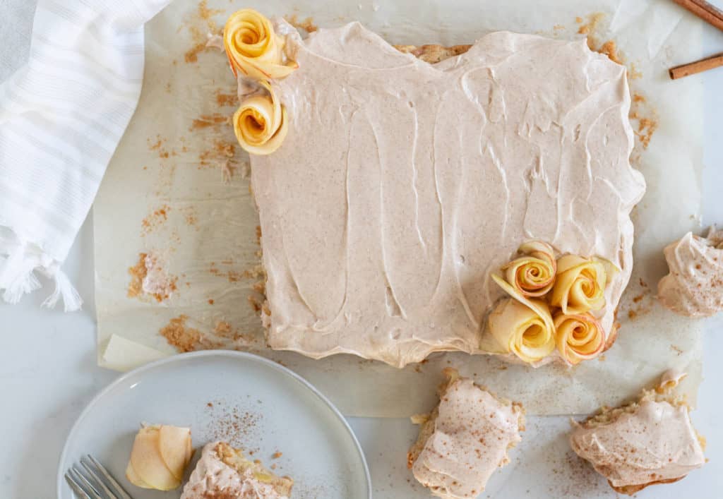 Apple sheet cake and slice of cake on plate.