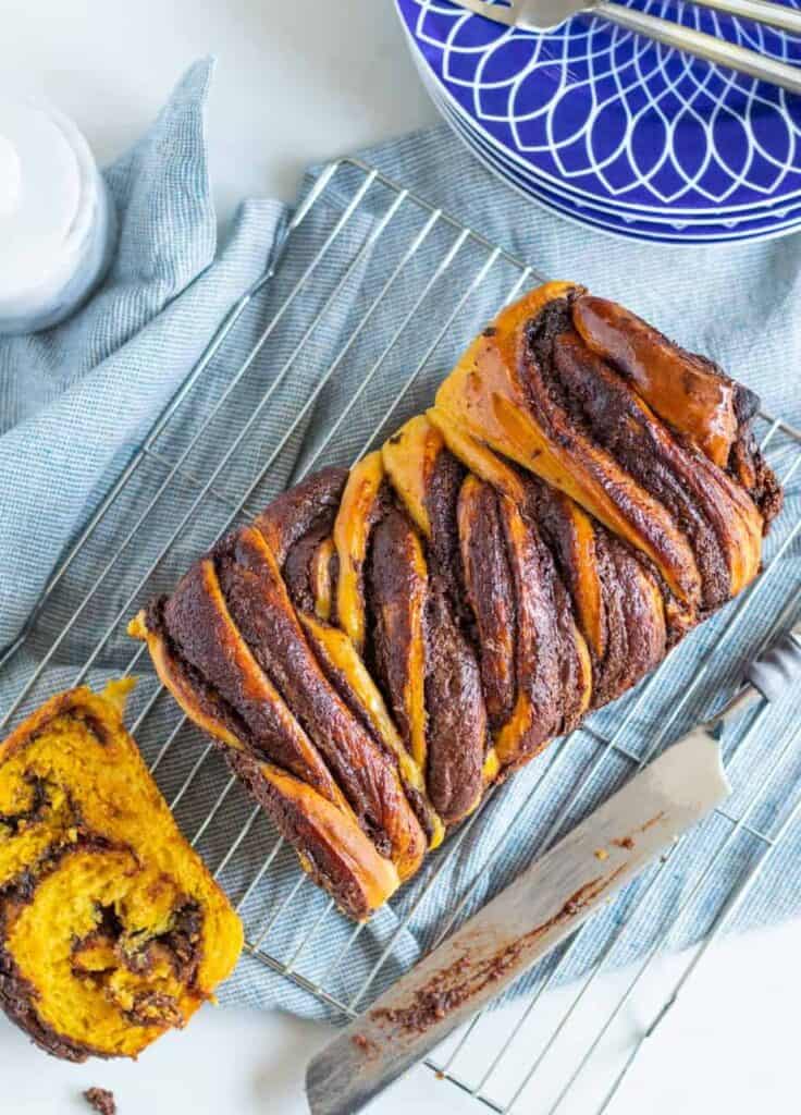 overhead shot of pumpkin nutella babka on a cooling rack