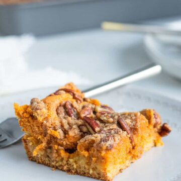 close up of gooey butter cake on a plate with a fork