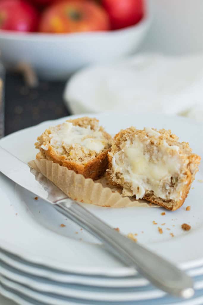 close up of apple crumb muffin with butter