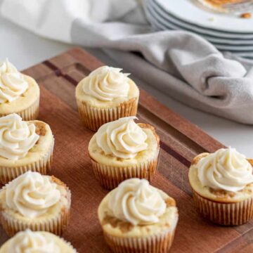 carrot cake cheesecake cupcakes on wood board