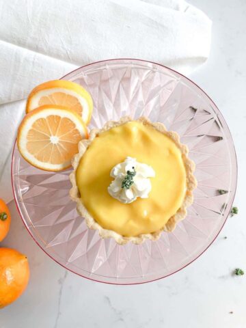 top view of meyer lemon tart on cake stand