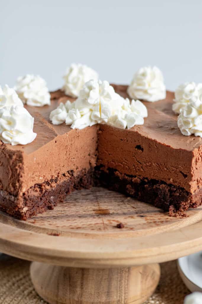 chocolate brownie mousse cake on a cake pedestal