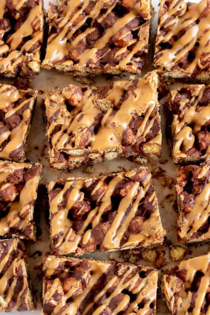 close up of cereal bars drizzled with peanut butter