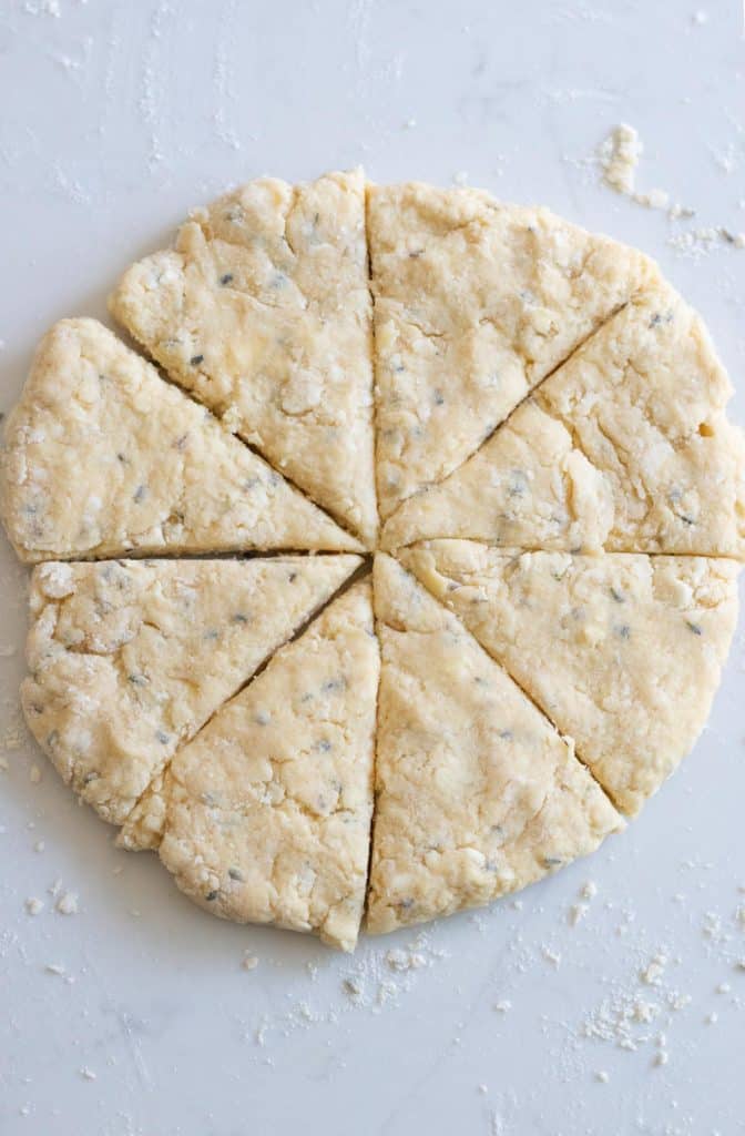 lavender scone dough cut into wedges