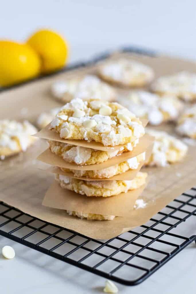 stack of lemon crinkle cookies on cooling rack