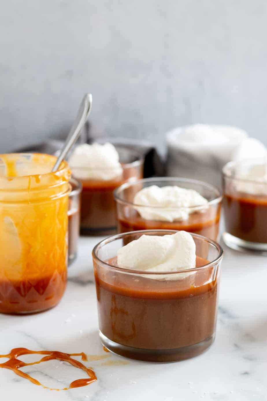 cups of chocolate budino with jar of salted caramel