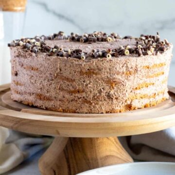 chocolate icebox cake on wood cake pedestal