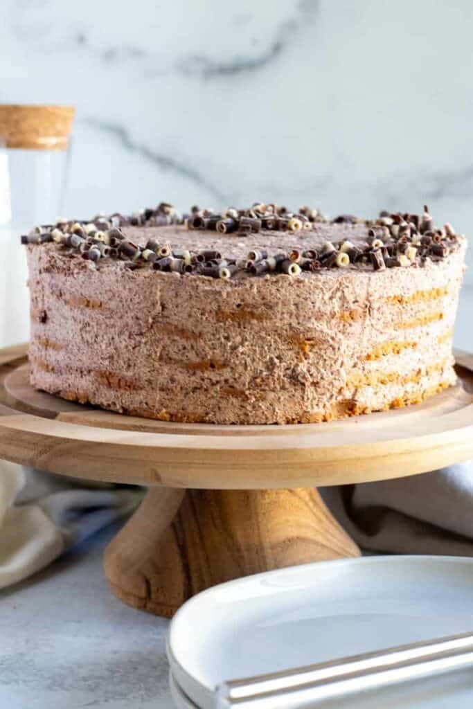 chocolate icebox cake on wood cake pedestal