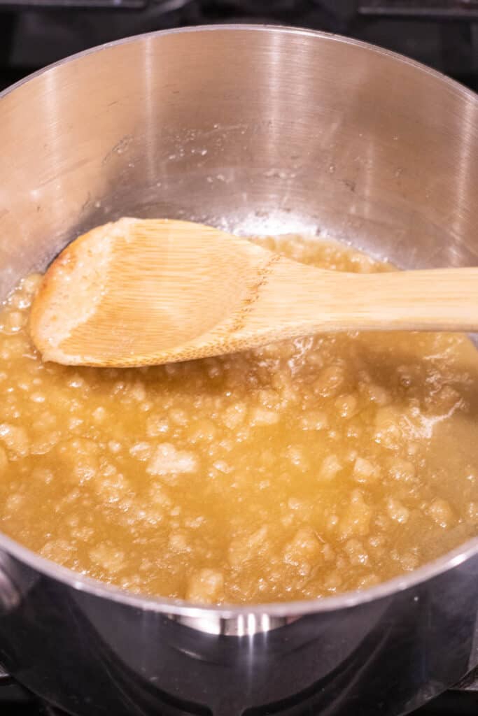 sugar turning brown and melting in saucepan