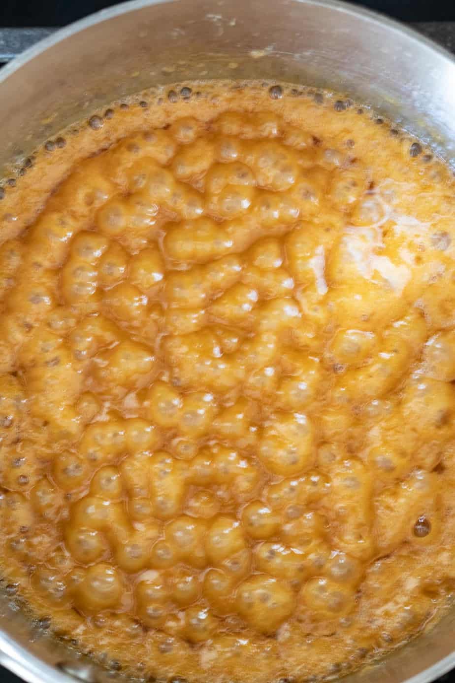 caramel bubbling in a saucepan