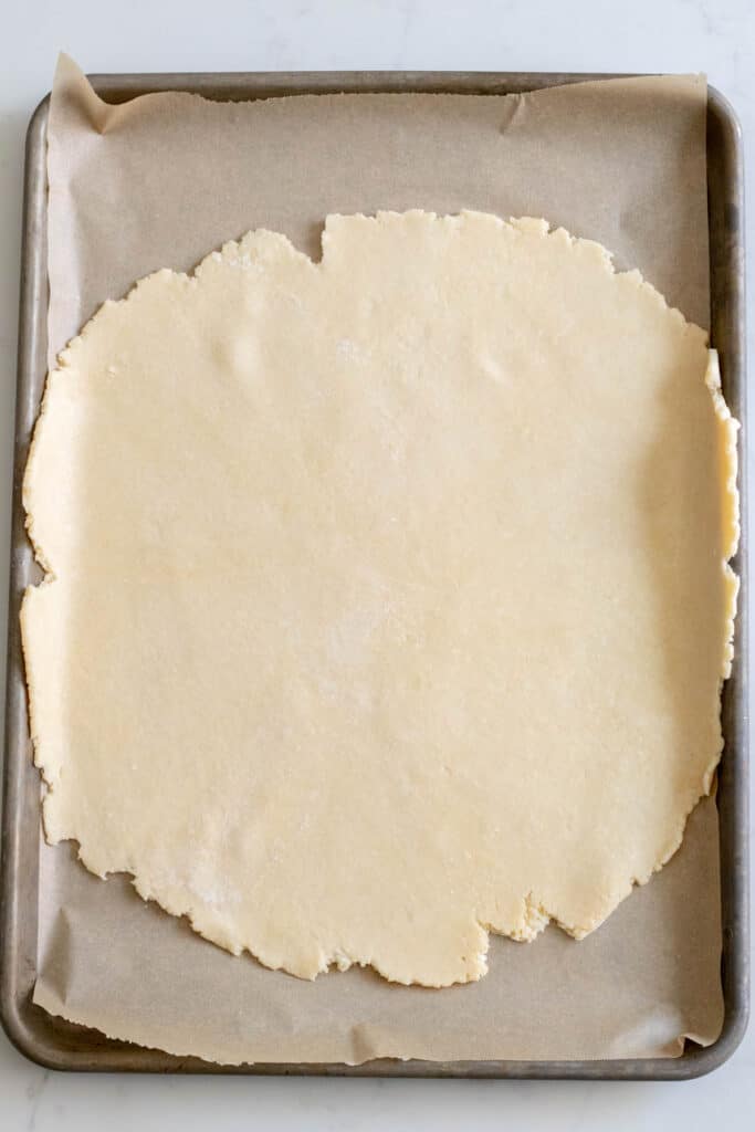 circle of pie dough on baking sheet