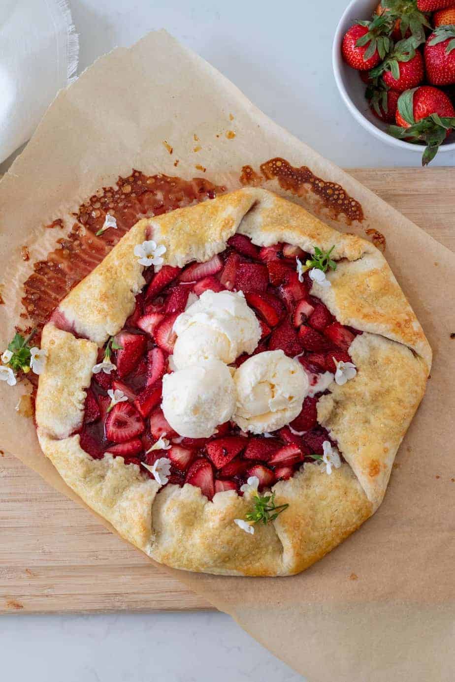 strawberry galette with scoops of vanilla ice cream