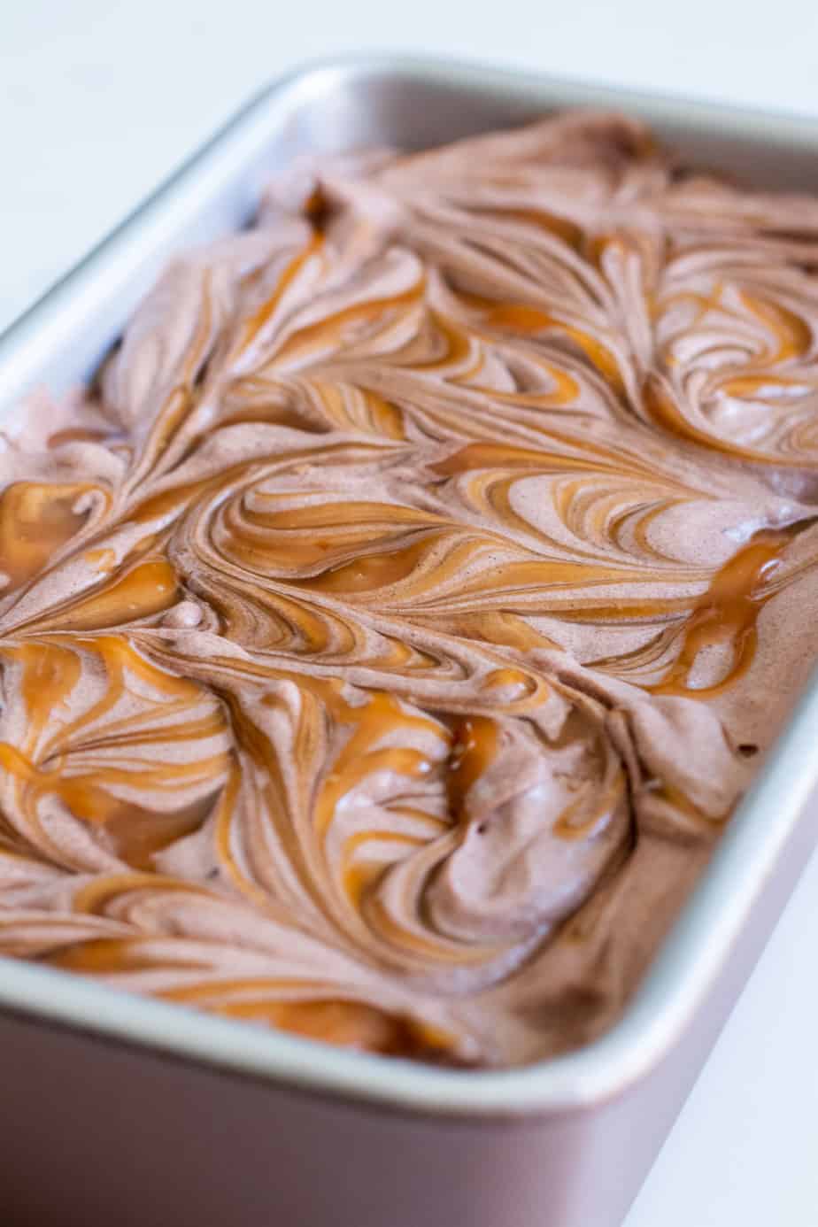 close up of chocolate ice cream with caramel swirls