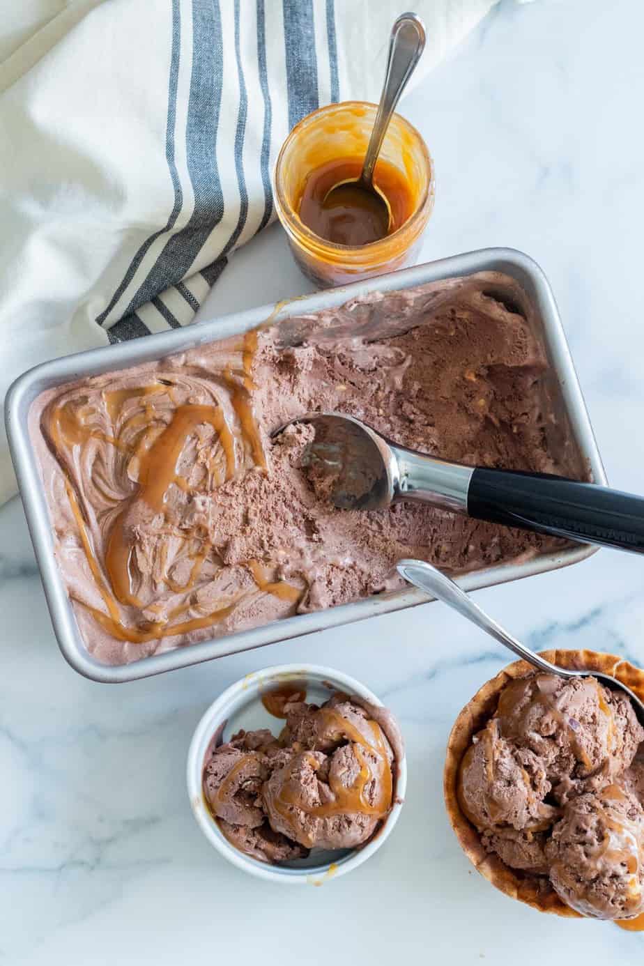 chocolate ice cream in a loaf pan with ice cream scoop