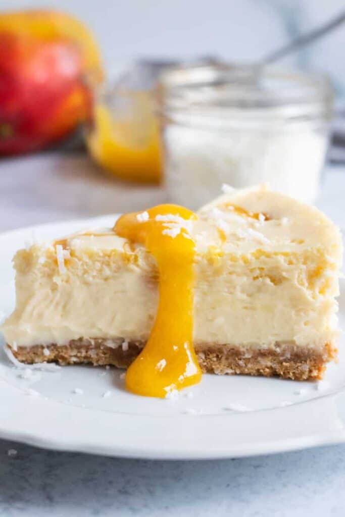 slice of mango cheesecake on plate