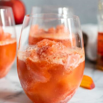 close up of a glass with peach bourbon slush