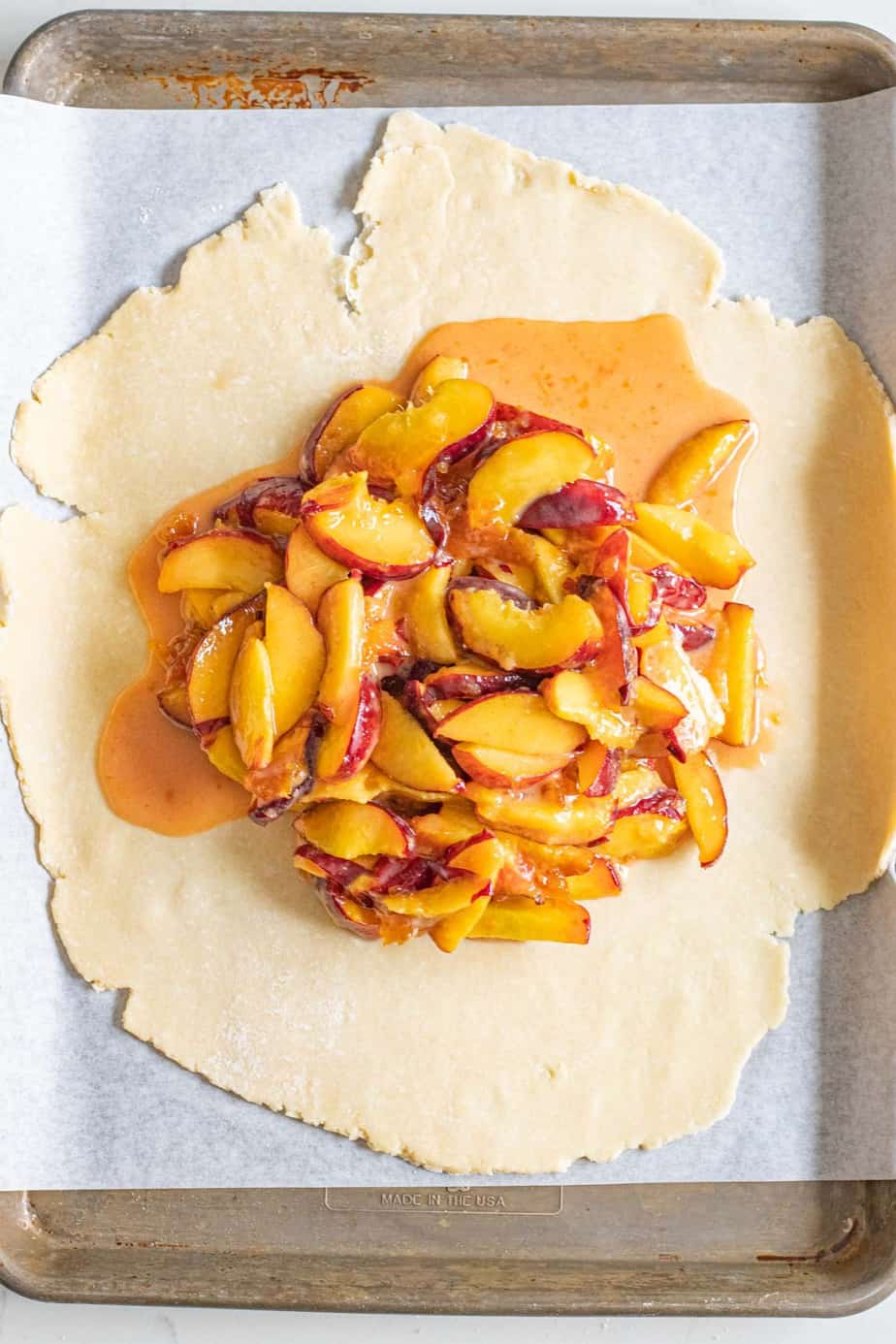 peach filling on circle of pie dough