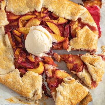 peach galette with scoop of vanilla ice cream