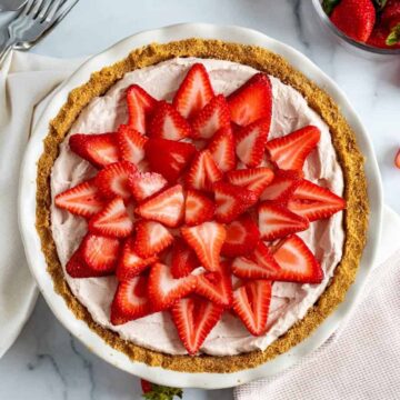 fresh strawberries atop a mousse pie