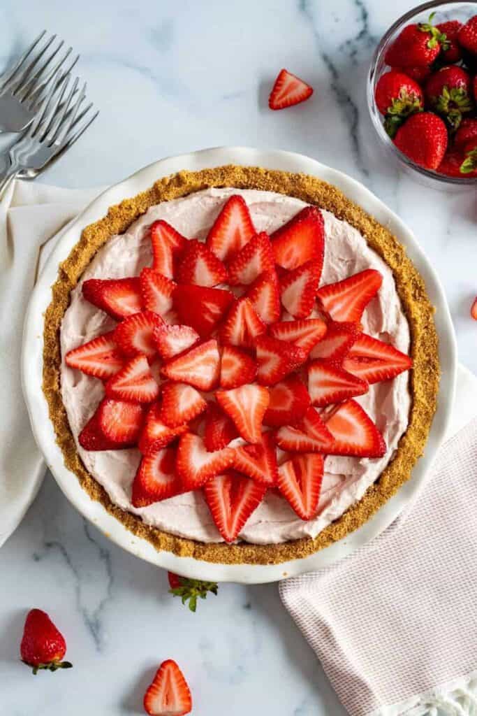 fresh strawberries atop a mousse pie