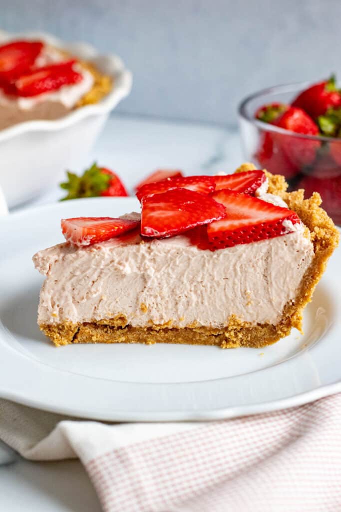 slice of strawberry mousse pie on a white plate