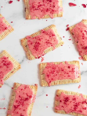chocolate pop tarts with strawberry glaze on a white marble counter