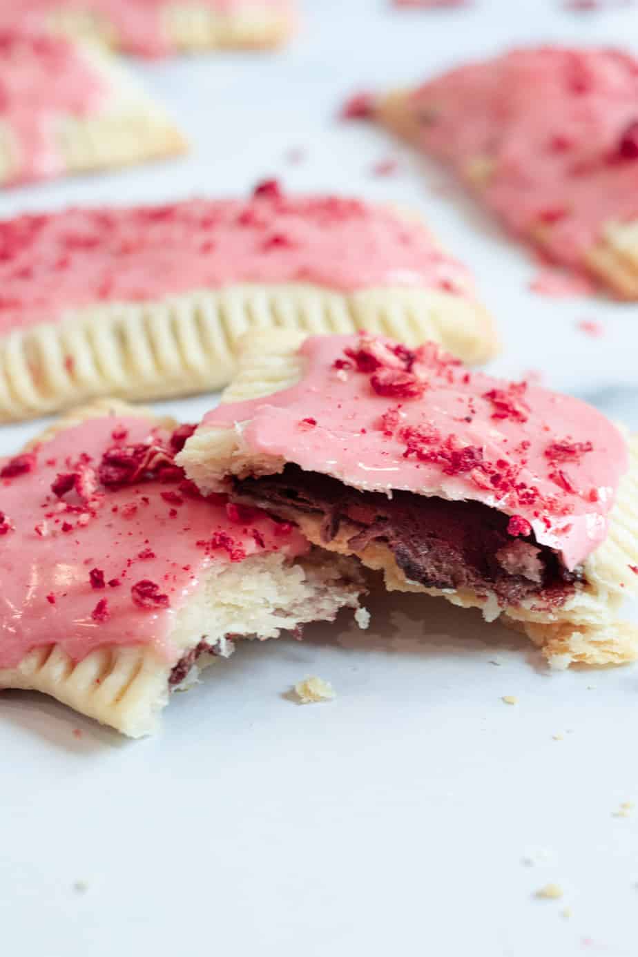 chocolate pop tart cut in half with strawberry glaze on top