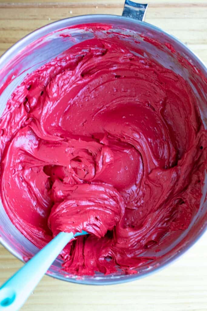 red velvet no-bake cheesecake filling in a mixing bowl