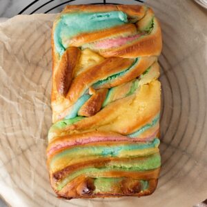 cream cheese babka with swirls of blue, pink, yellow and green cream cheese