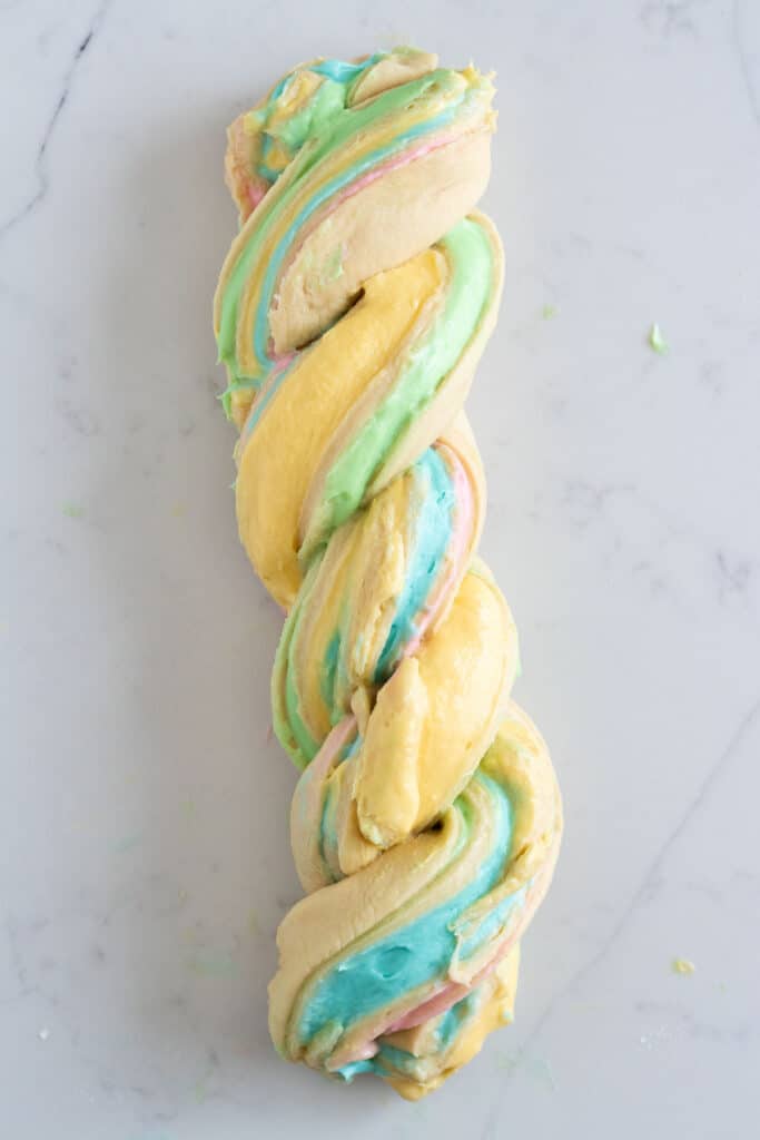 babka dough twisted together showing swirls of pastel colored cream cheese filling