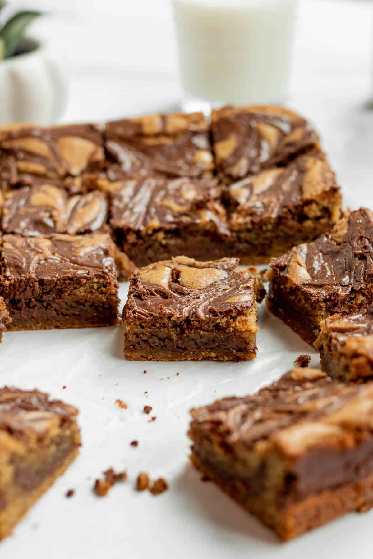 nutella blondies cut into squares on a marble background