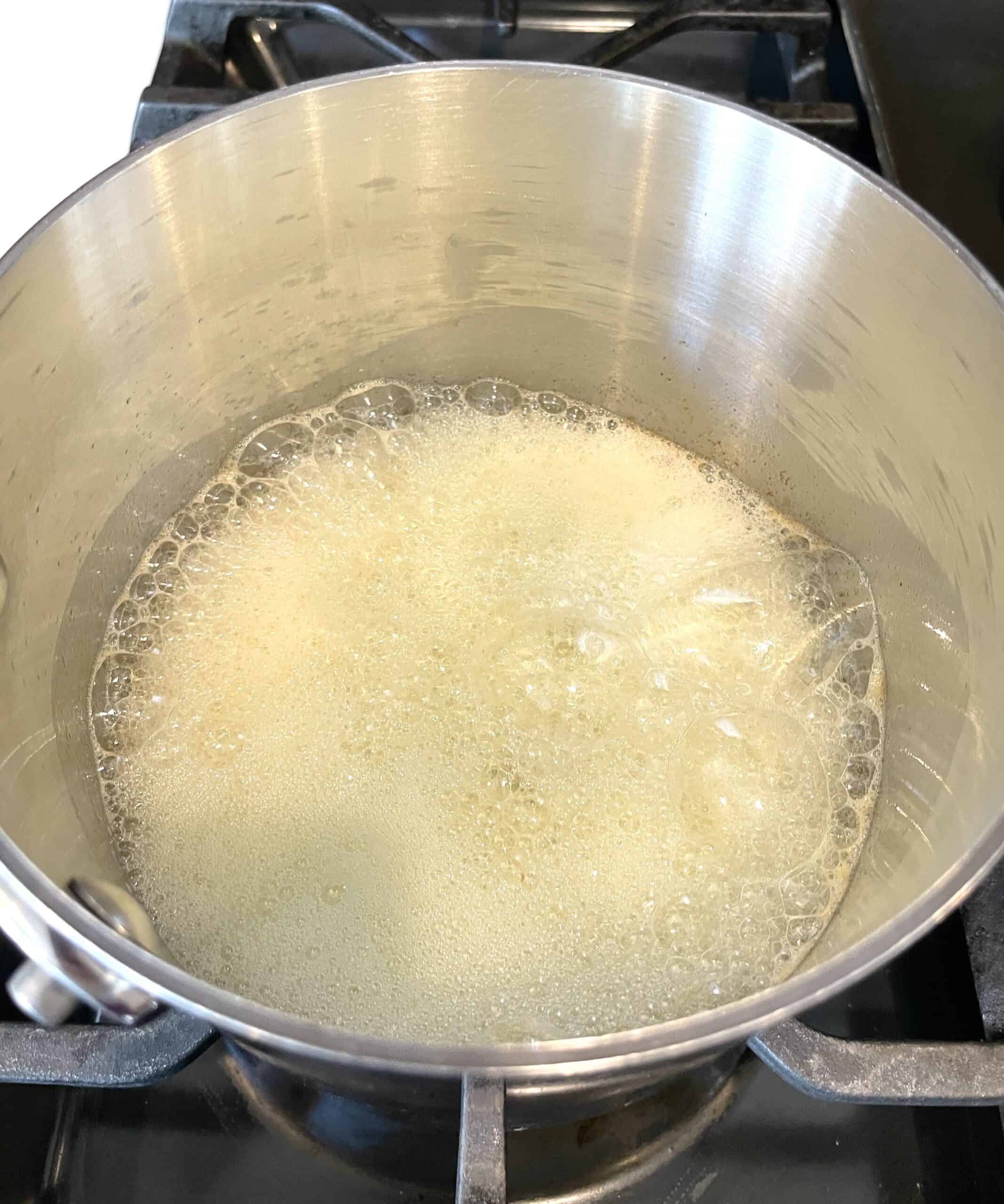 foamy melted butter in a saucepan