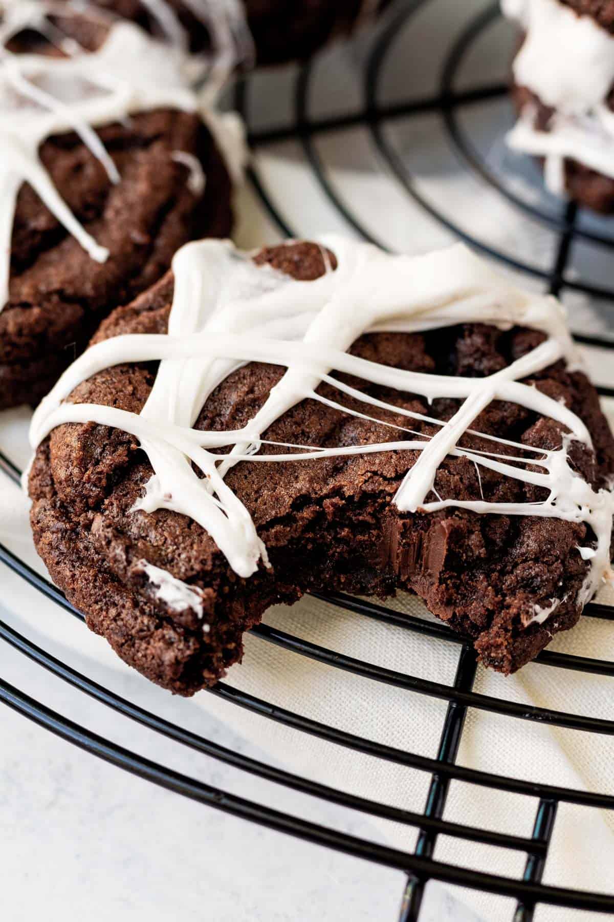 close up of a spider web cookie with a bit out of it