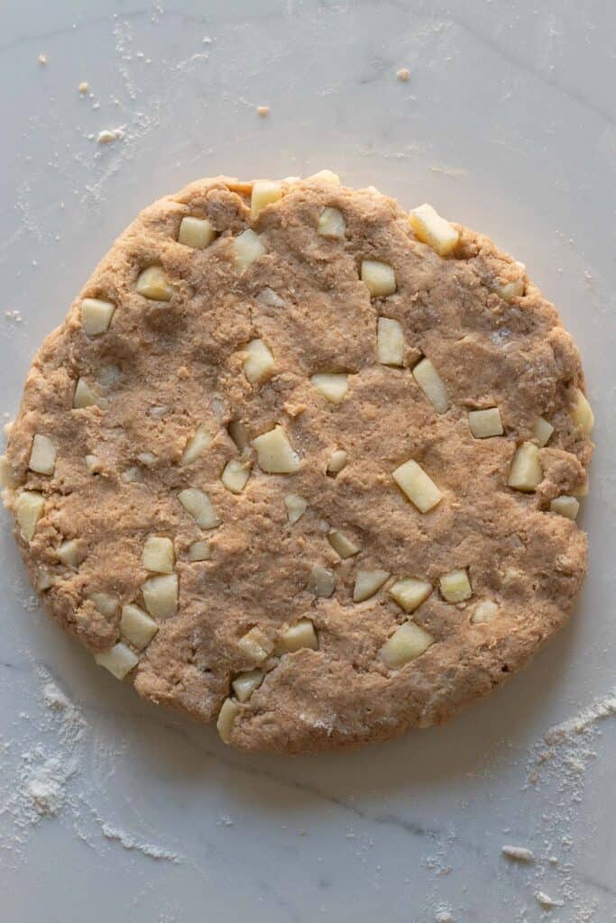 round disc of apple cinnamon scone dough