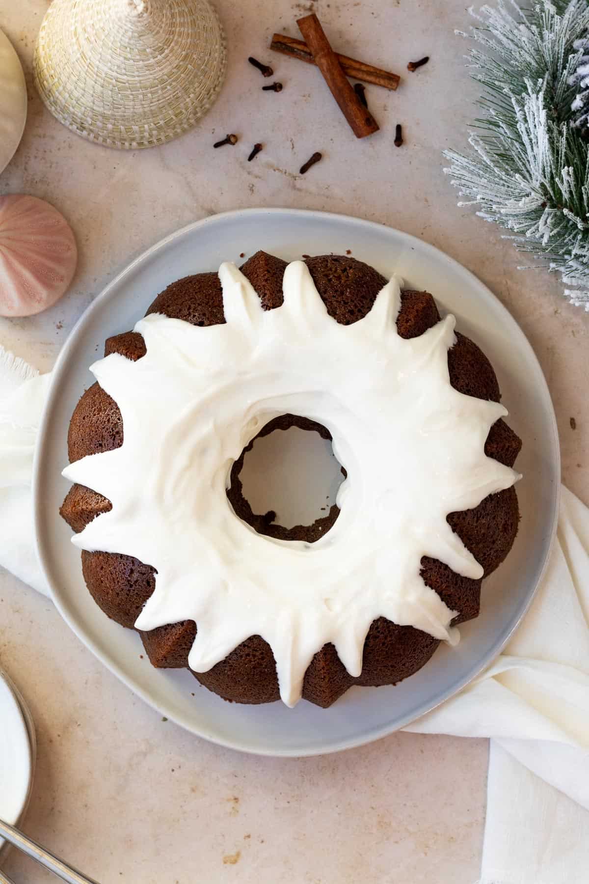 overhead view of a gingerbread bundt cake with cream cheese glaze