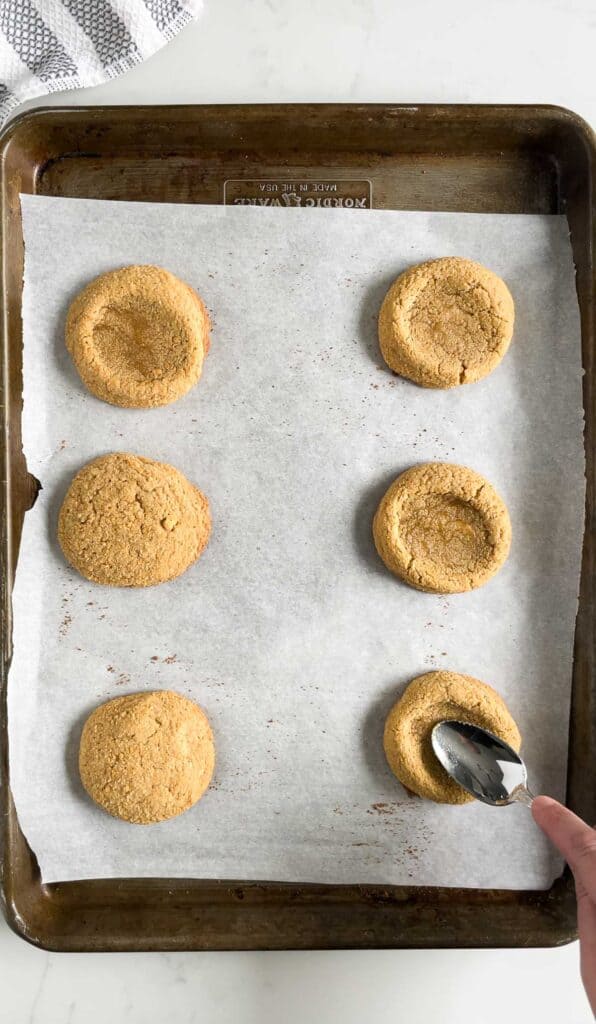 forming a thumbprint in graham cracker cookies