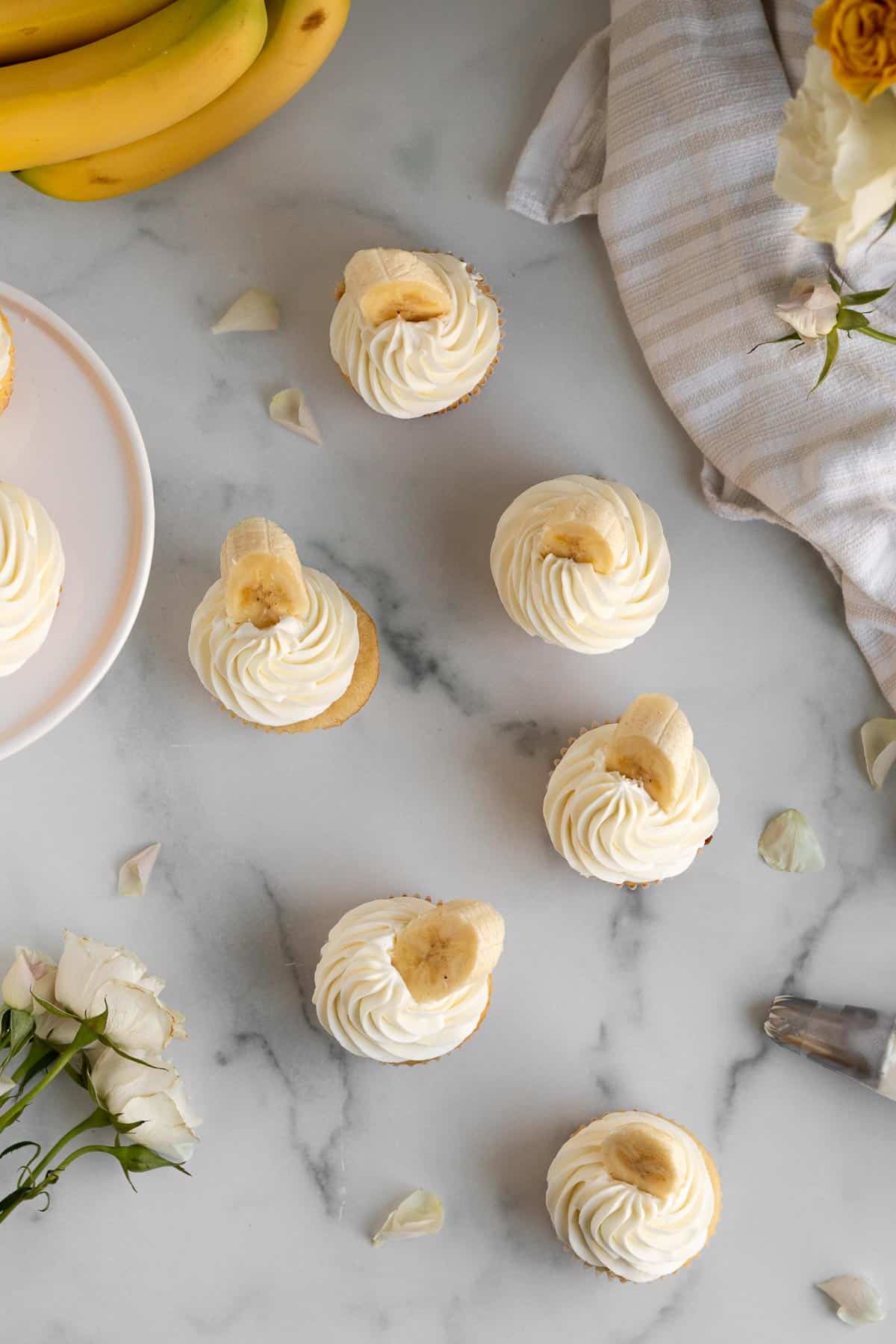 overhead shot of banana pudding cupcakes on a marble background