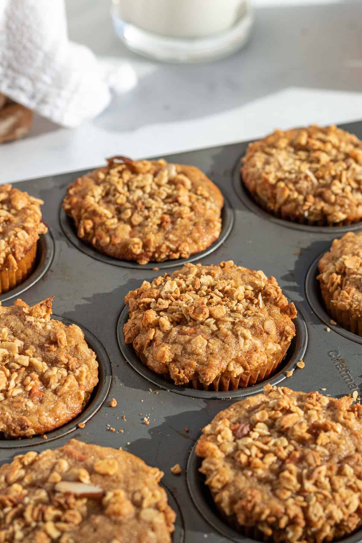 banana carrot muffins in a muffin tin